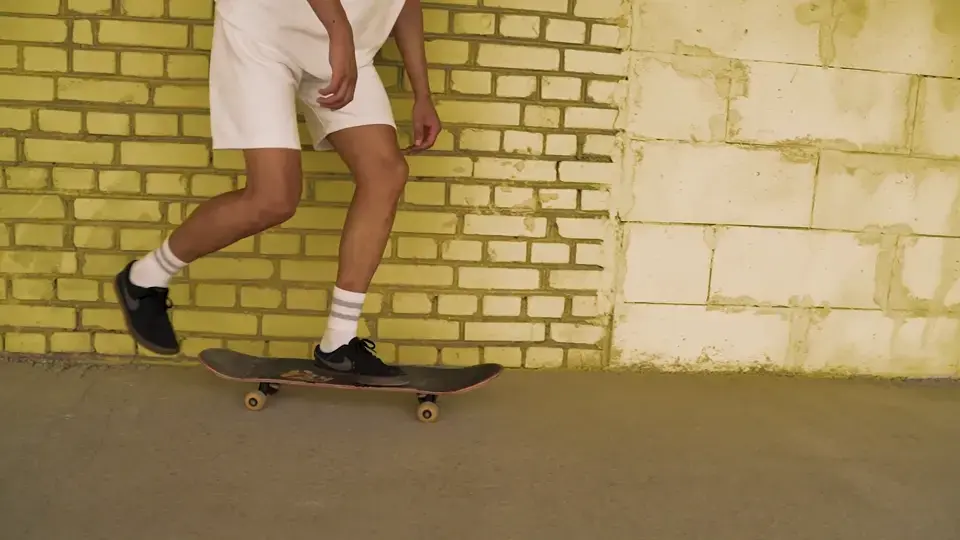 A skateboarder practising a new trick
